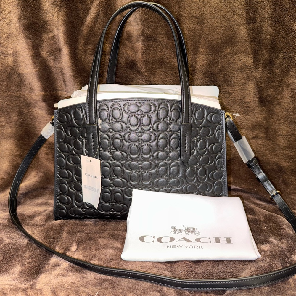 BRAND NWT: Coach Charlie Carryall 28 Inch Signature Leather.
Color: Black.